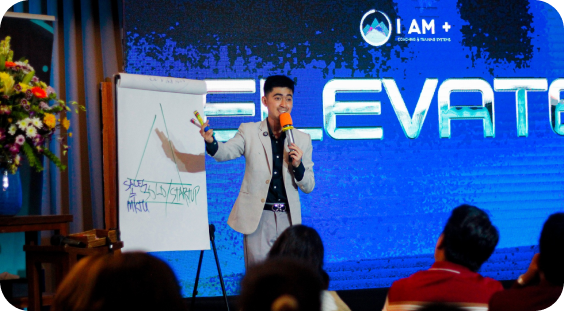 coach migs teaching participants about self-growth in his community